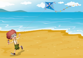 A beach with a boy playing