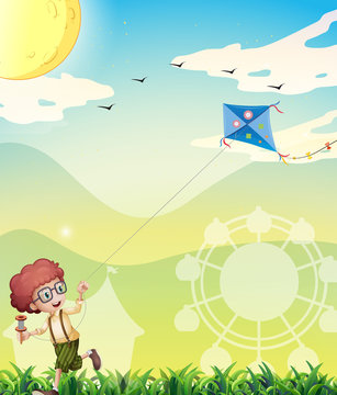 A boy playing with his kite