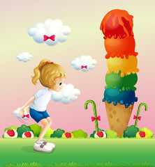 A girl in a jumping position near the giant icecream