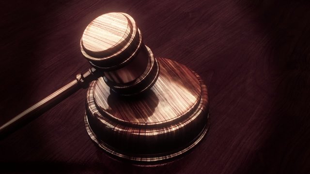 Judge gavel with lighted background looping animation