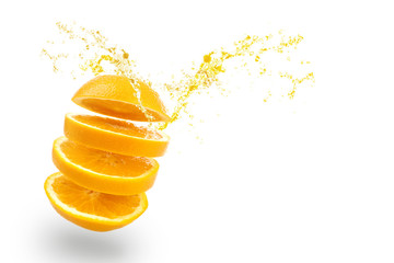 sliced of orange with splashing juice on white background