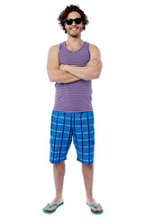 Smiling confident guy in beach wear
