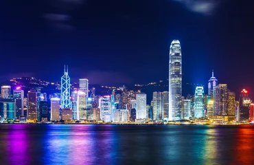 Fotobehang Hong-Kong De skyline van Hong Kong bij nacht