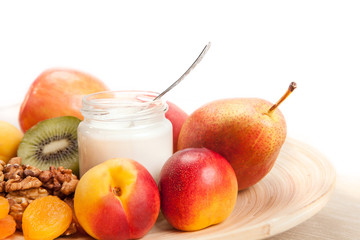 Fruits and yogurt on the dish