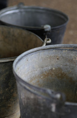 Obraz na płótnie Canvas Old tin metal vintage buckets