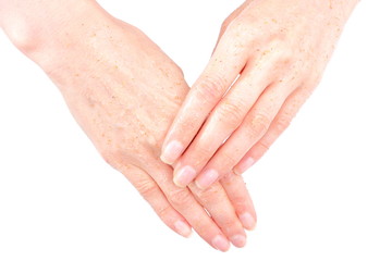 Fototapeta premium Hand of woman puts a cosmetic cream, peeling hand,