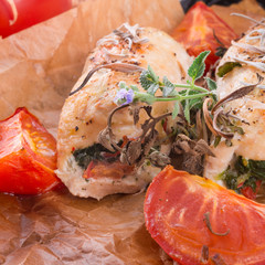Chicken breast with spinach, baked tomatoes and herbs