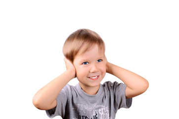 cheerful boy 5 years shut by the hands ears