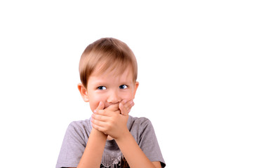 cheerful boy 5 years shut by the hands mouth