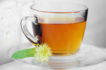 Glass cup of tea with linden