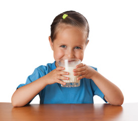 Girl drinks milk, isolated on white
