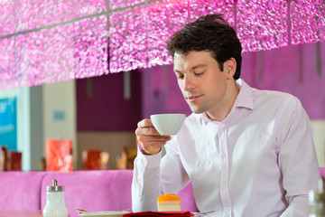 Young man in ice cream parlor