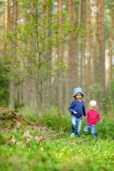 Two adorable little sisters hiking