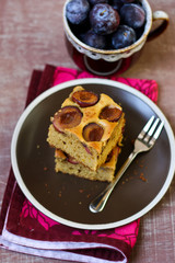 Plum cake bars and bowl of plums