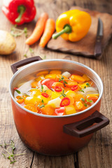 vegetable soup in red pot