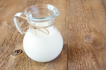 Milk on wooden table