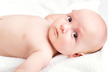 Cute baby lying on towel