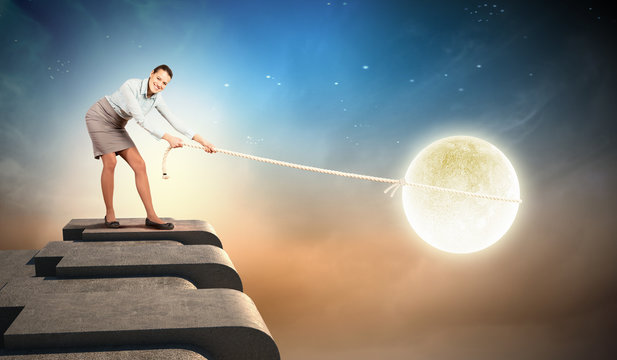 Woman pulling moon