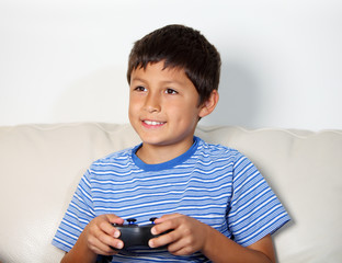 Young boy playing computer game © Nicholas B