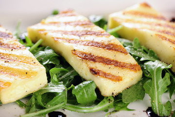 Grilled Halloumi cheese on rocket salad