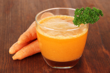 Fresh carrot juice on table close-up