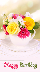 Obraz na płótnie Canvas Beautiful bouquet of bright flowers in color mug,