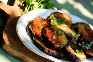 fresh eggplant salad over the wooden vintge background 