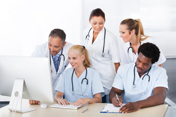 Group Of Doctors Working Together