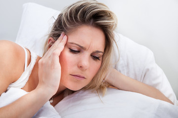Portrait of woman with headache