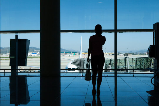 Silhouette of women in airport terminal