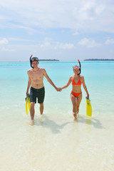 happy young couple have fun on beach
