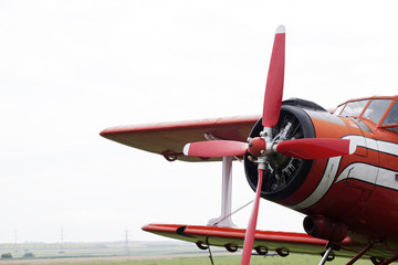 red airplane preparing for flying