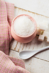 Sugar on wooden background
