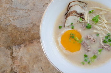 rice gruel with pork and egg mixed