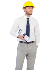 Young architect posing with hard hat and plan