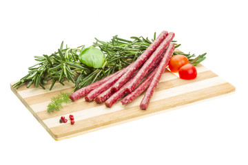 Salami with rosemary, basil and tomato