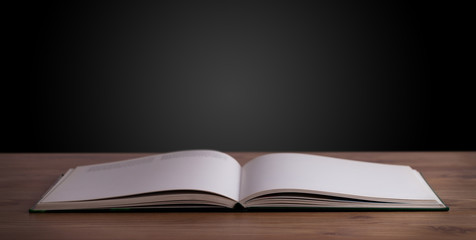 Open book on wooden deck