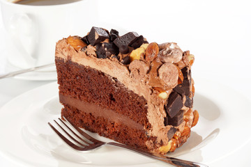 Sweet chocolate cake topping almond nut with coffee