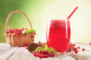 Fresh currant drink on wood