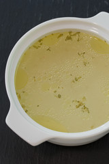 chicken soup in white bowl