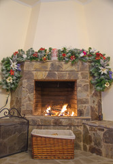 Fototapeta na wymiar fireplace decorated with noel ornaments