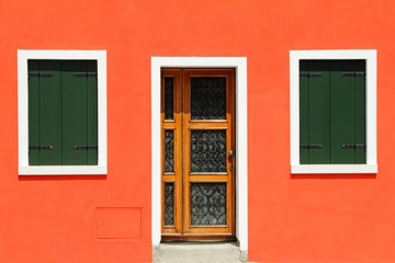 front door in vivid painted  house in Burano village