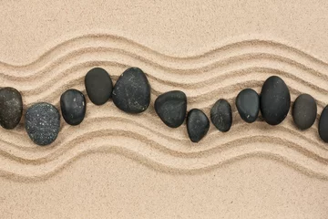Fototapete Steine im Sand Schwarze Steine im Sand