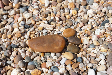 Stone foot on the stony beach