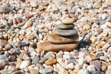 Fototapeta na wymiar Stack of pebble stones on the beach