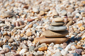 Fototapeta na wymiar Stack of pebble stones on the beach