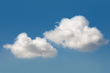 Naklejka na ściany i meble Fluffy white clouds in the blue sky