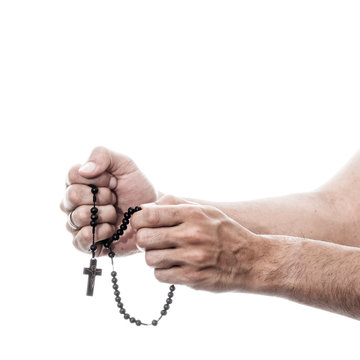 Male Hands Praying With Rosary