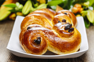 Traditional swedish buns in autumn setting. A saffron bun