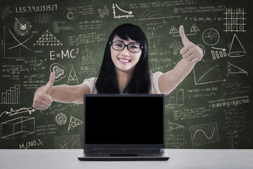 College student thumbs up in class